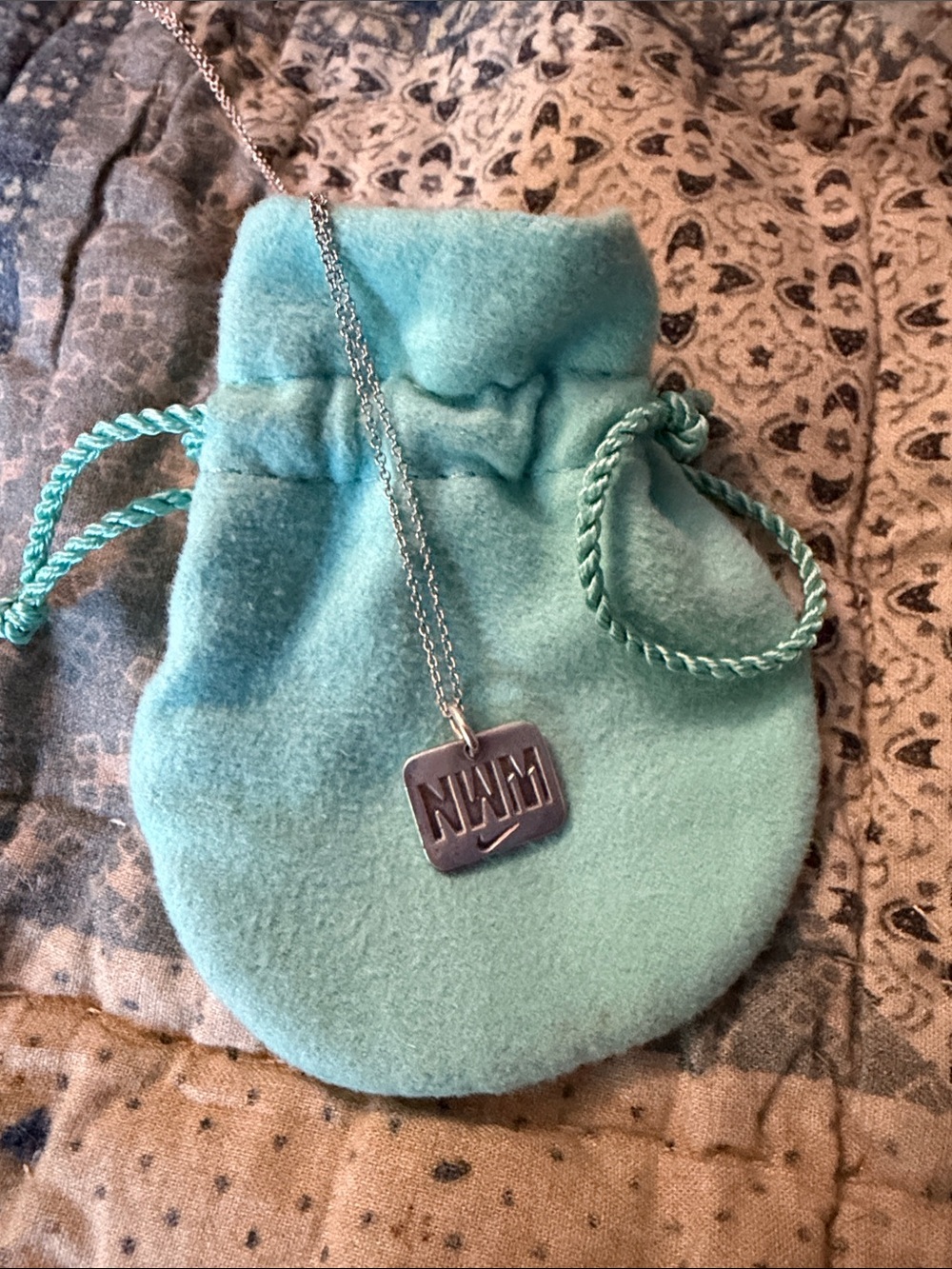 Nike Silver 'NWM' Pendant Necklace with Aqua Pouch